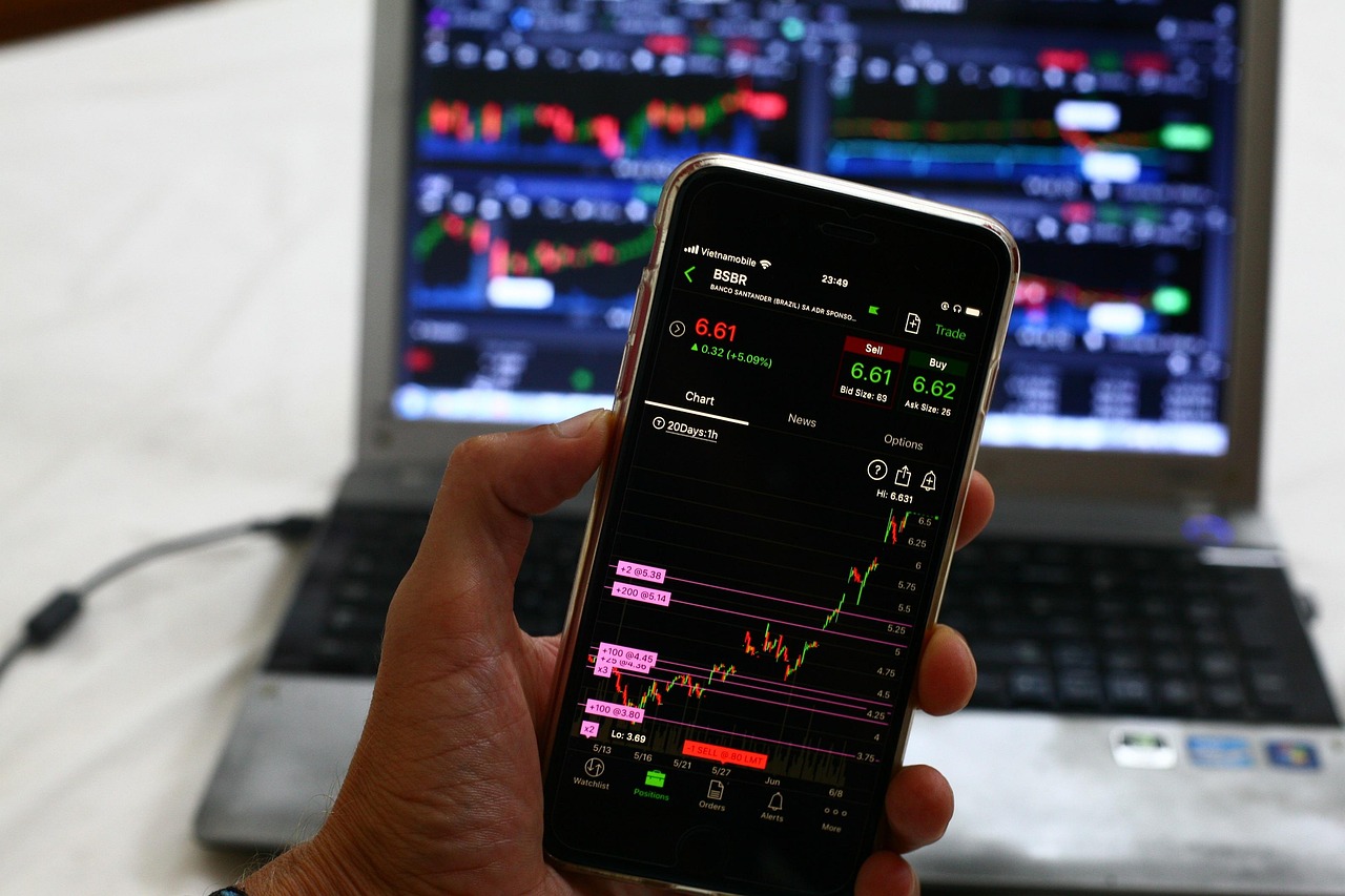 A digital display showing green upward trends in the stock market index.