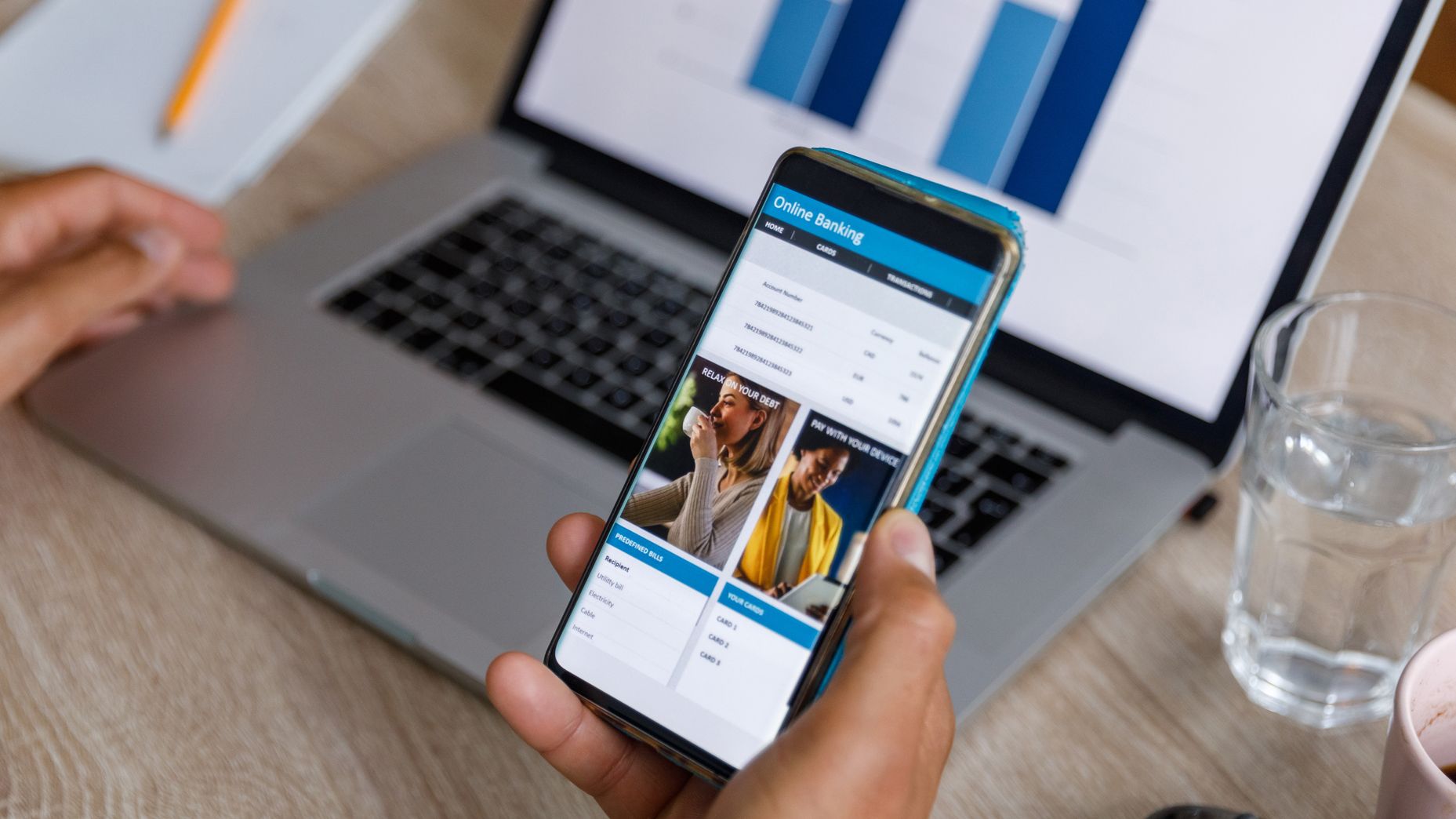 A person using a smartphone to manage their high-yield savings account through a mobile app.