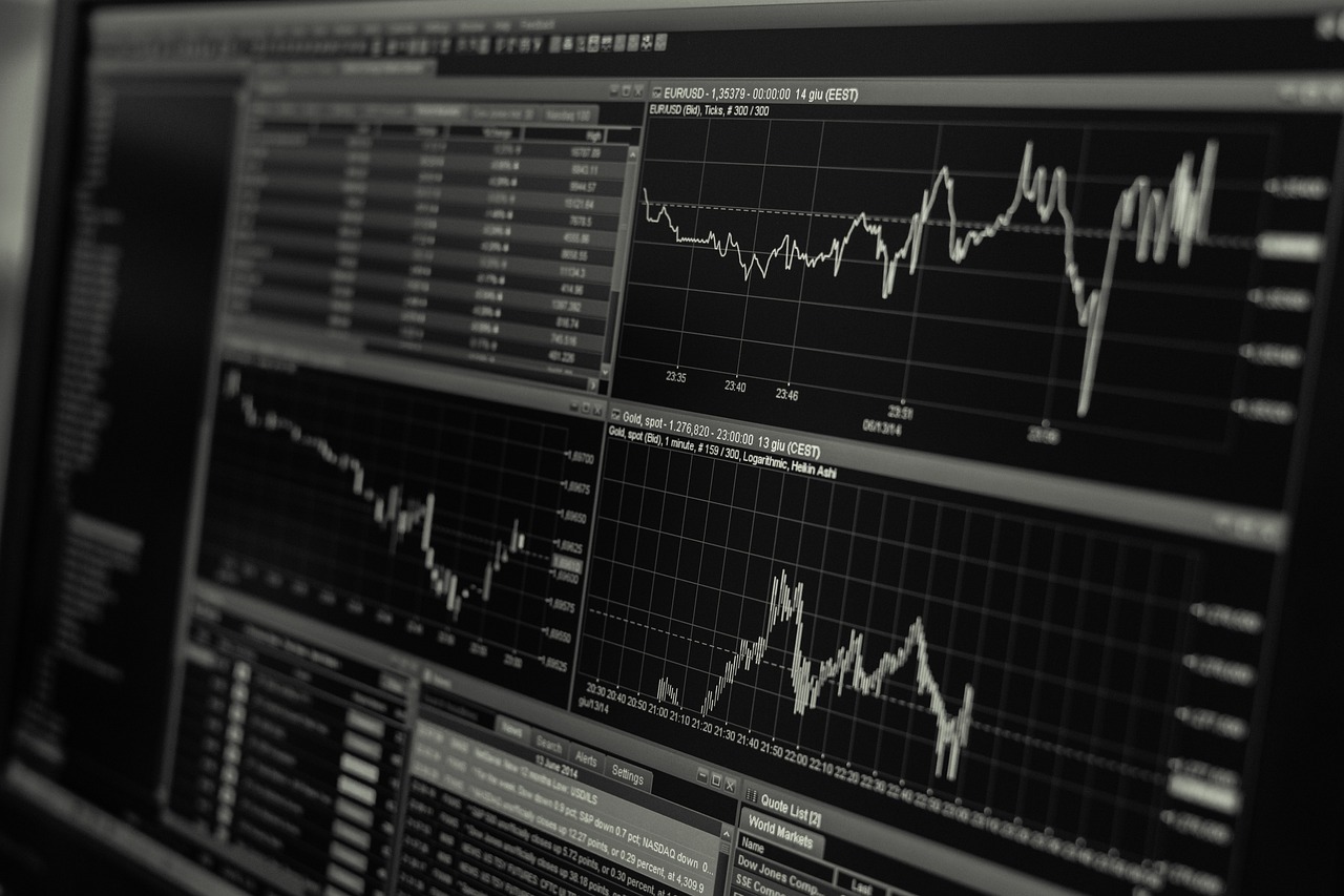 A magnifying glass held over a complex financial graph with red highlighting.