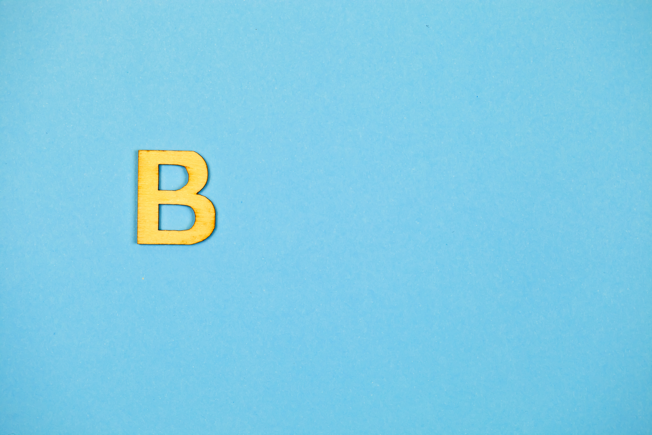 The letter B on a blue background.