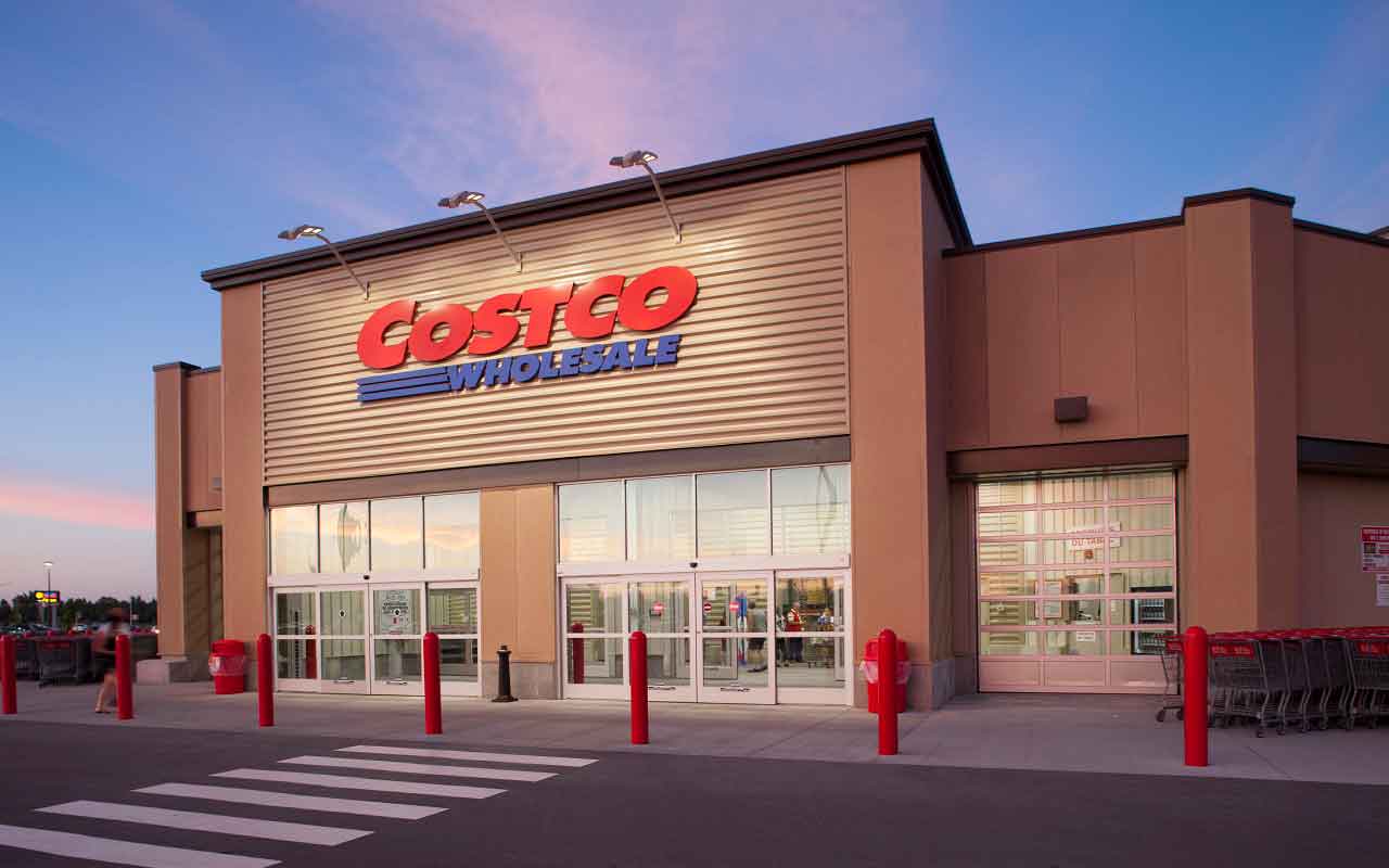 The exterior of a Costco warehouse club showing the scale of the facility.